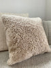Side view of tan shearling sheepskin pillow