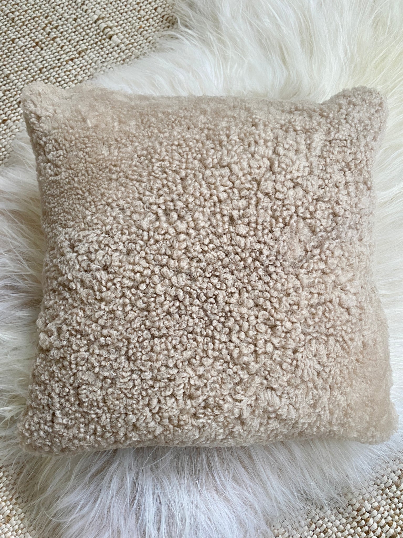 Top-view of tan shearling sheepskin pillow