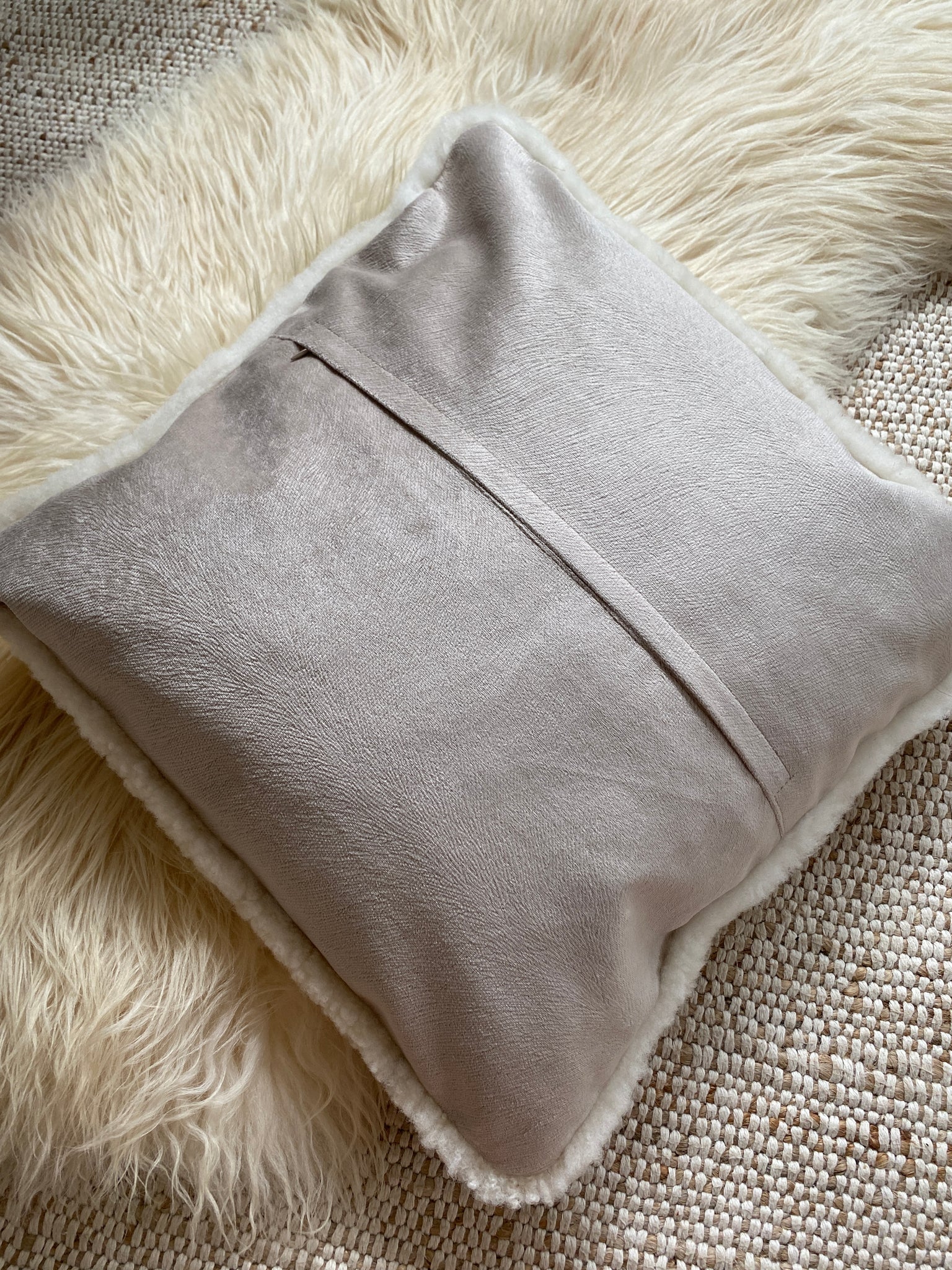 Rear view of tan shearling sheepskin pillow