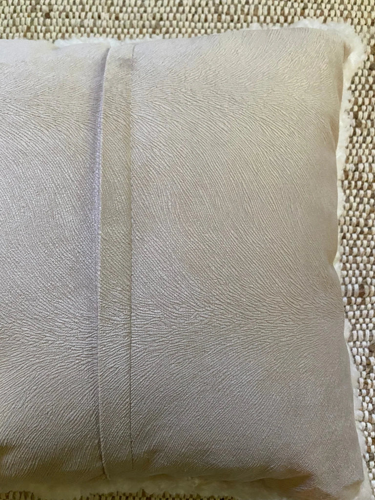 Rear-view of ivory shearling sheepskin pillow