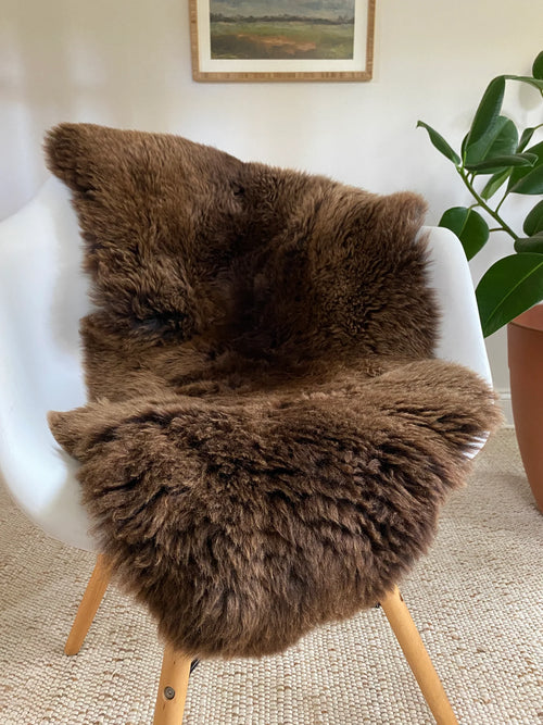 classic light brown sheepskin throw on a chair 