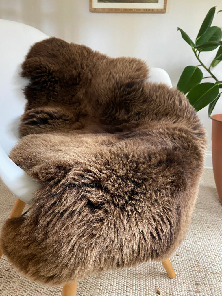 classic light brown sheepskin throw on a chair 