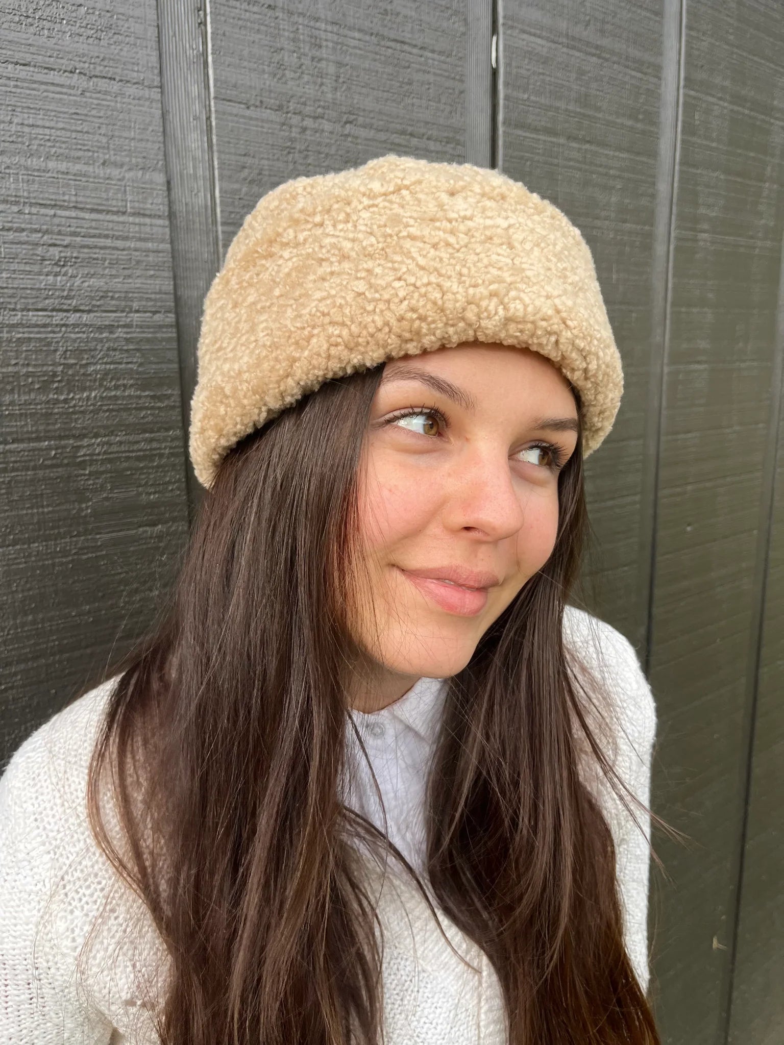 Woman wearing a cortina beanie sheepskin bucket hat