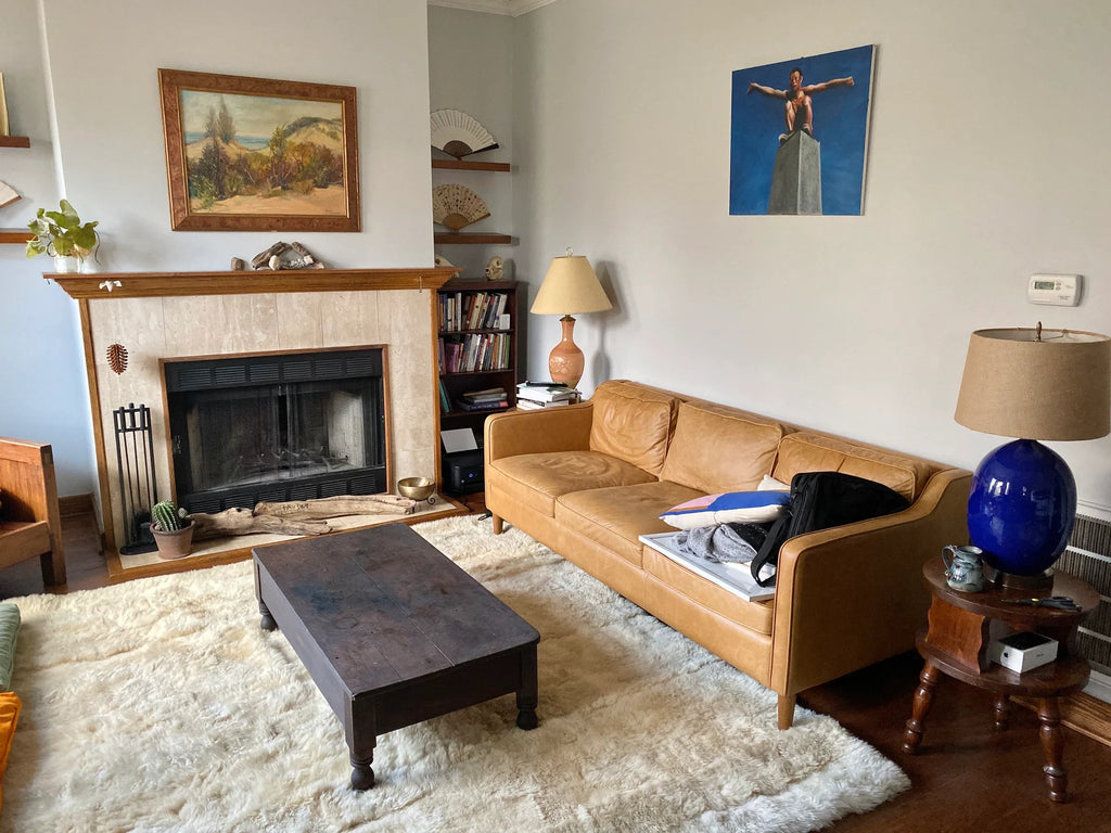 Living room with creamy ivory sheepskin bed cover rug