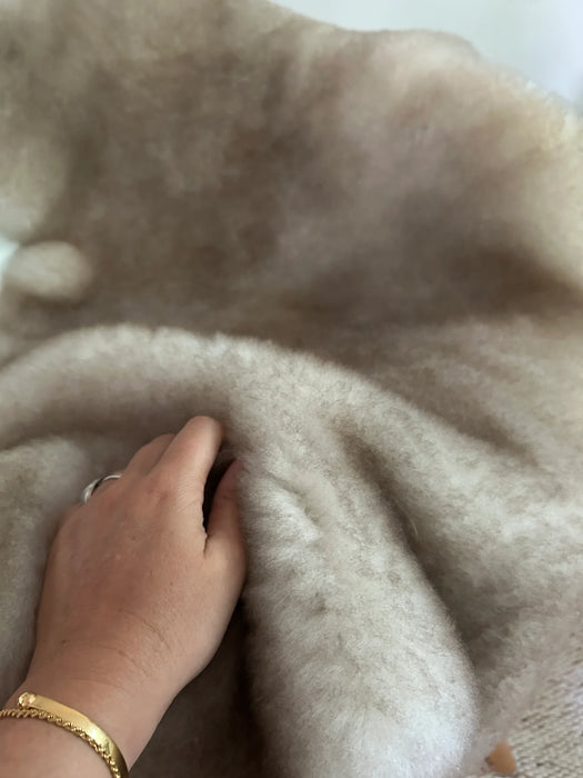 Close-up of greyish brown shortfur sheepskin