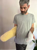Man holding a medical grade sheepskin kidney warmer and waist belt