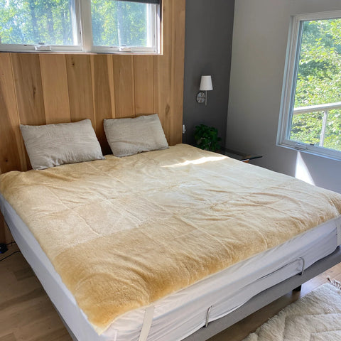 Bed with medical grade sheepskin mattress cover