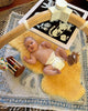 Baby lying on medical relugan nursery sheepskin 