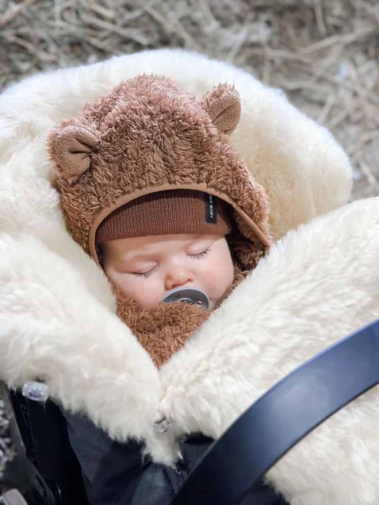 Open sleeping bag showing interior sheepskin texture