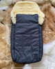 Detail shot of stitching and zipper on black sheepskin sleeping bag