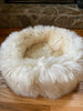 Side-view of plush ivory animal snug