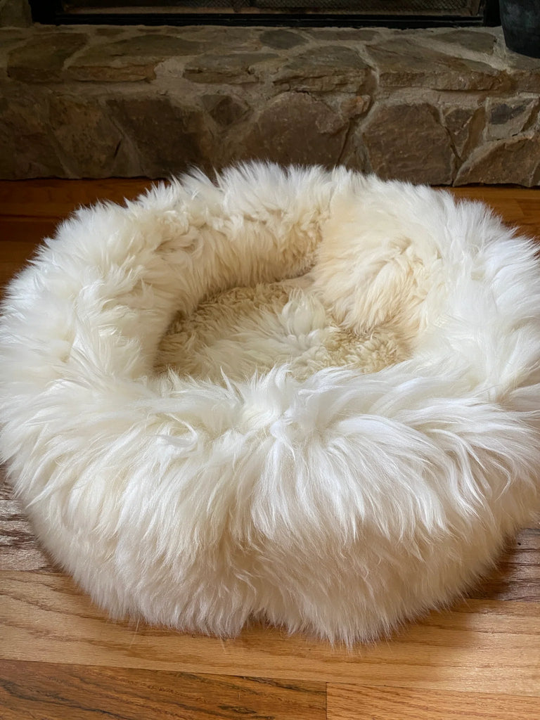 Side-view of plush ivory animal snug