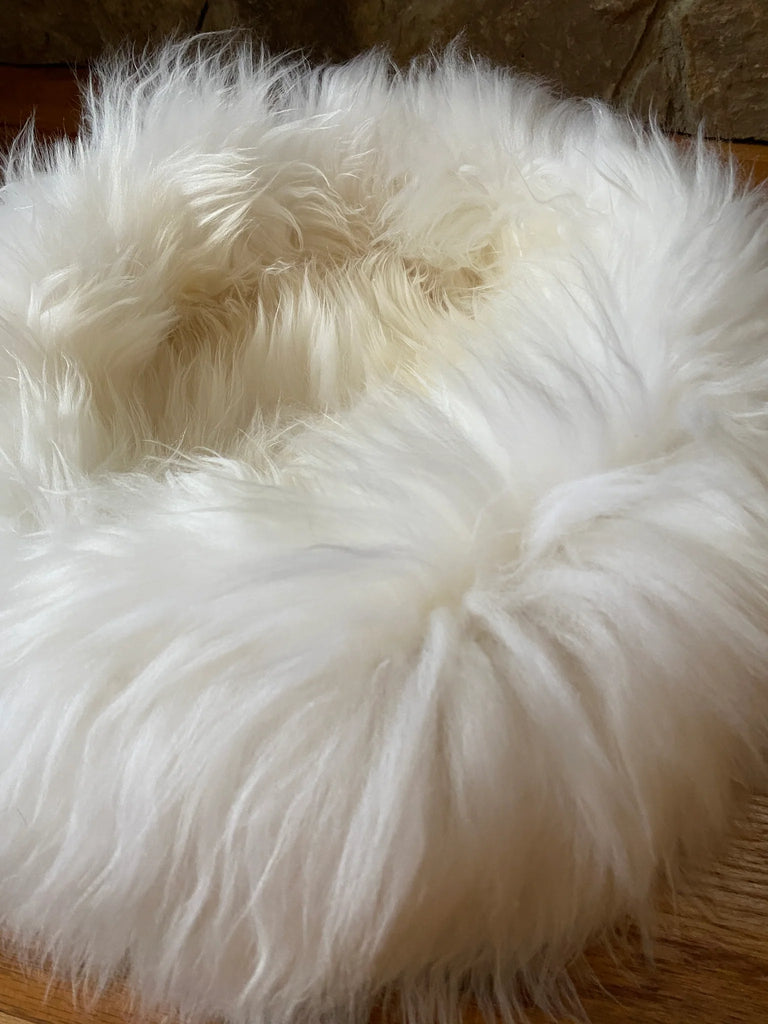 Side view of plush ivory animal snug