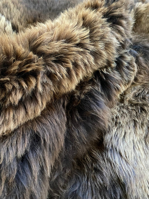 Close-up of plush rich brown sheepskin quad