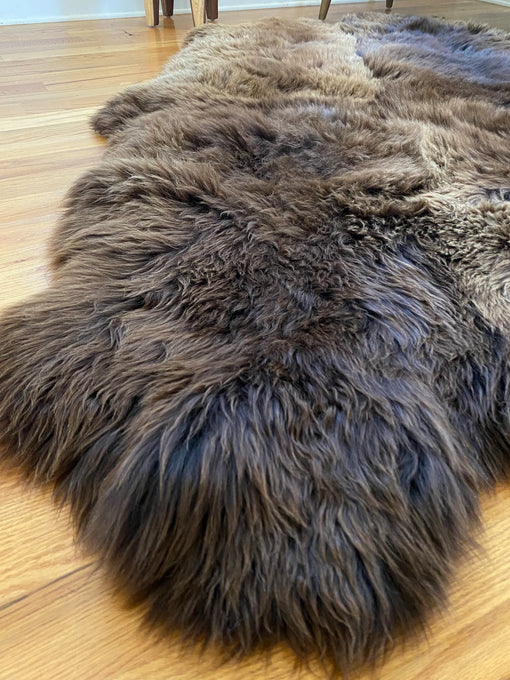 Side-view plush rich brown sheepskin quad