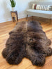 Side-view of plush rich brown sheepskin quad