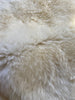 Detailed shot showing natural fur texture of ivory rug