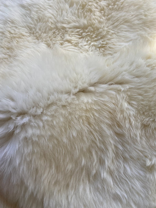 Detailed shot showing natural fur texture of ivory rug