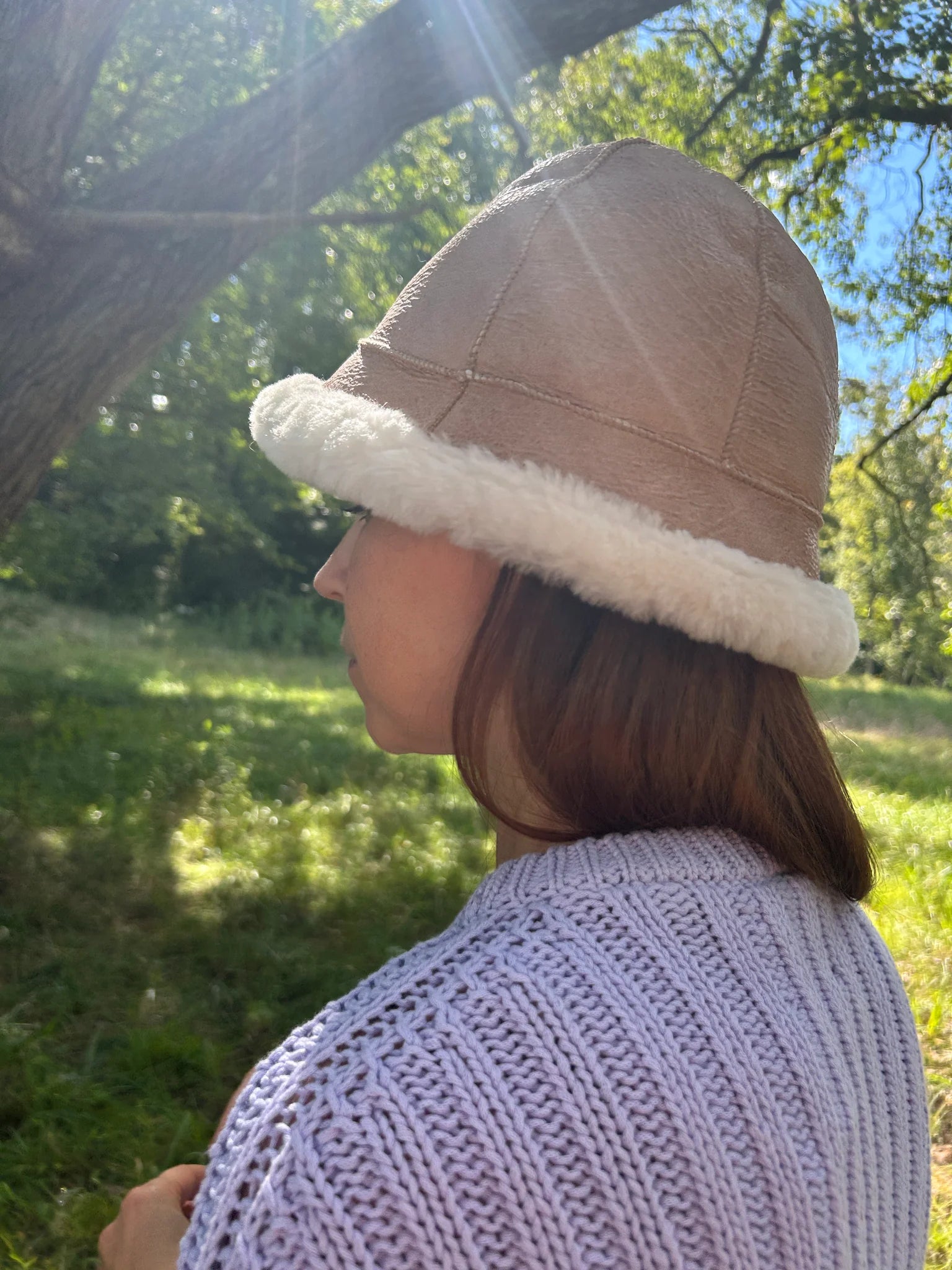 Person wearing santa-fe sheepskin bucket hat