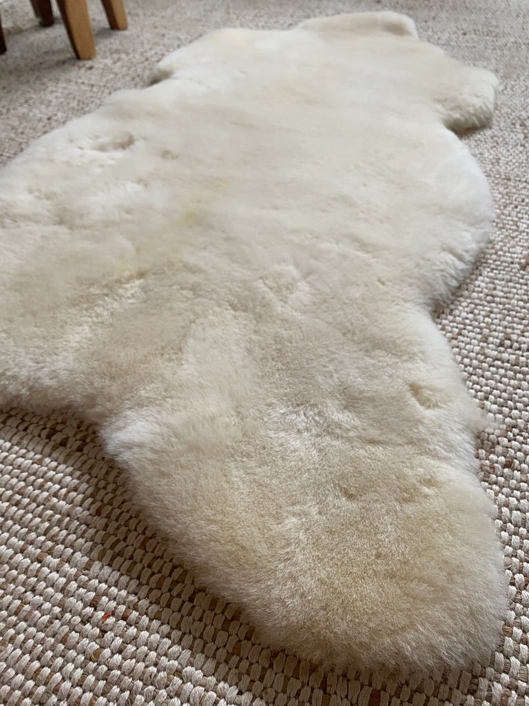 Edge view showing natural curves and thickness of sheepskin rug