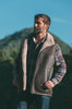Man wearing a leather sheepskin mens vest