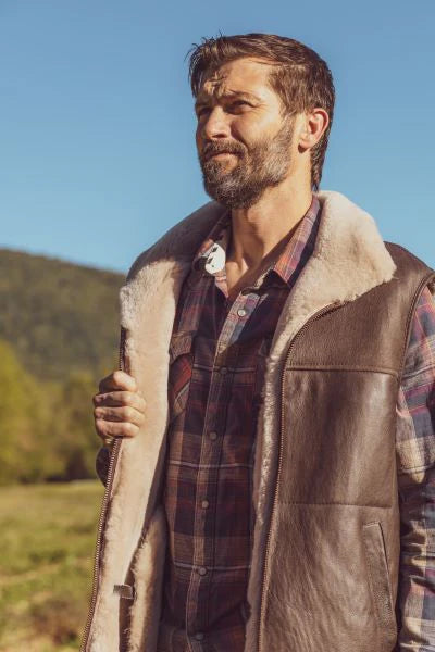 Man wearing a brown leather sheepskin mens vest