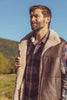 Man wearing a brown leather sheepskin mens vest