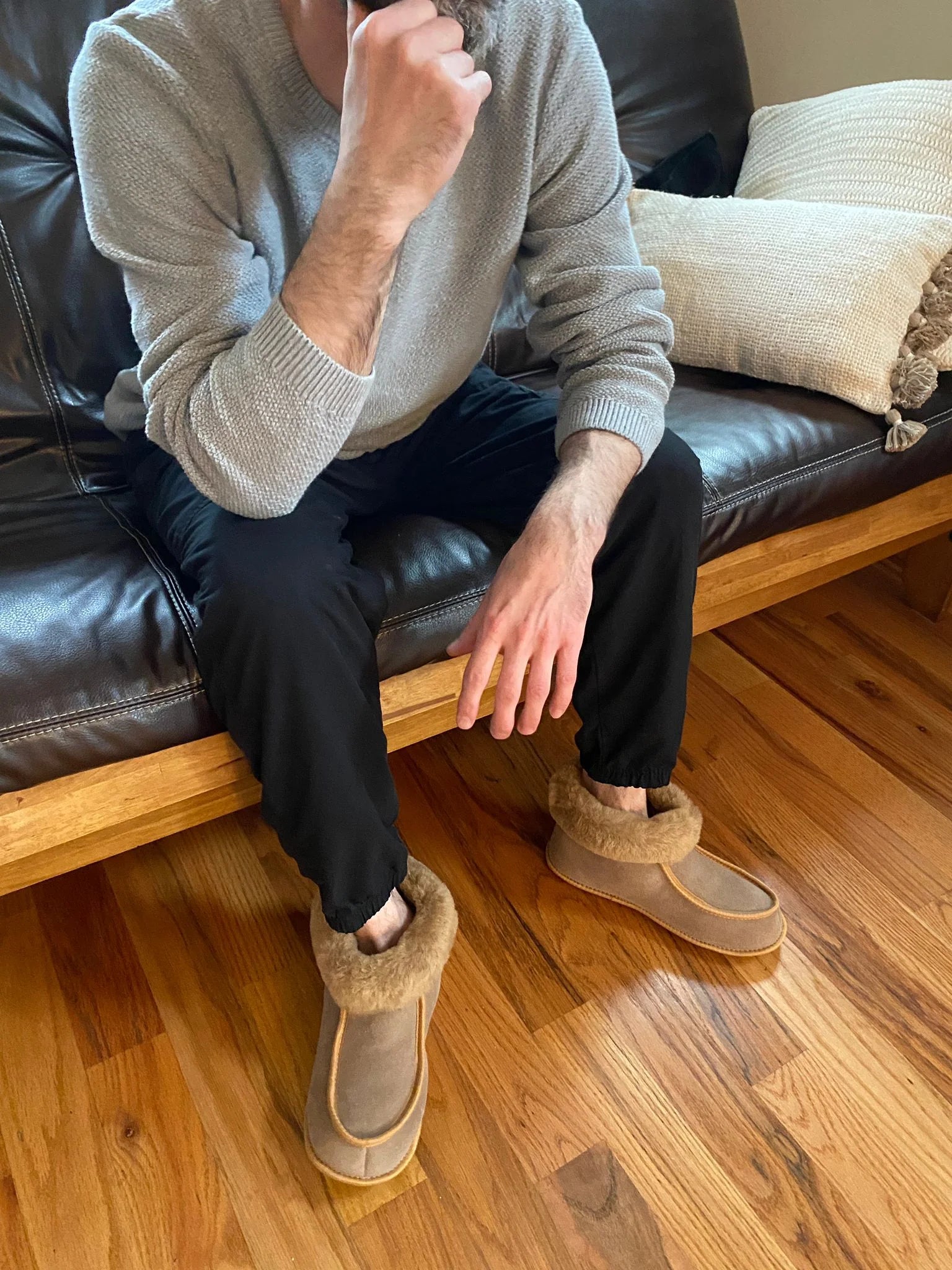 Pair of sheepskin slippers arranged side by side