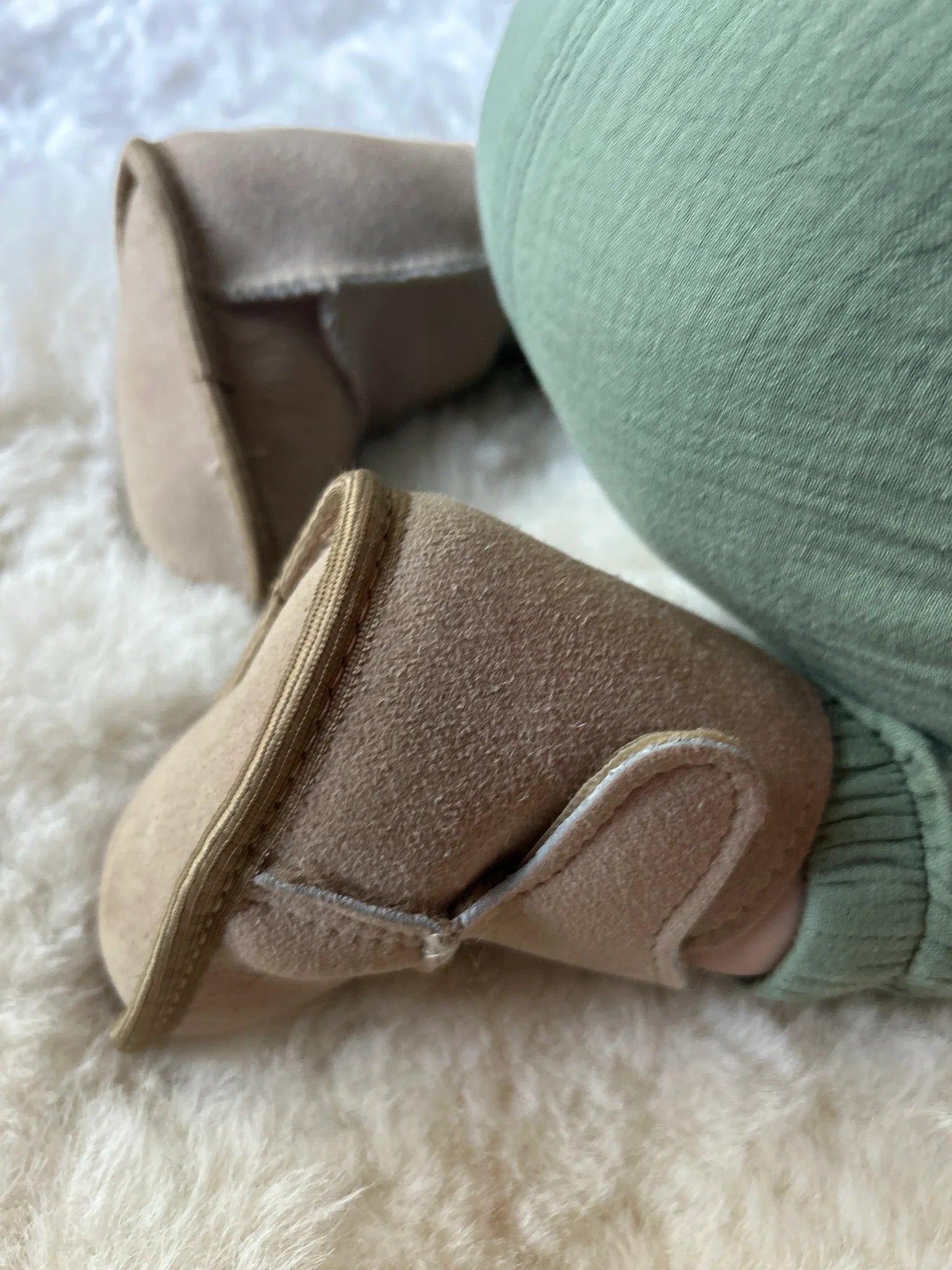 Close-up of terra slipper sheepskin minimalist footwear for kids with tan fur