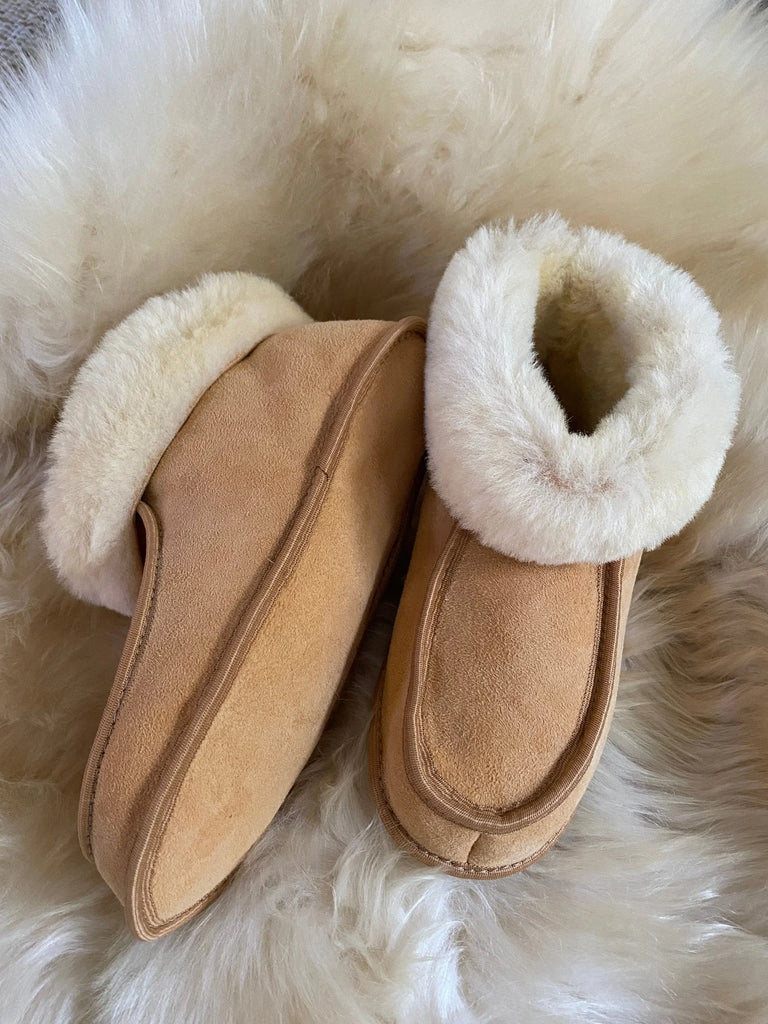 Pair of terra slipper sheepskin minimalist footwear tan