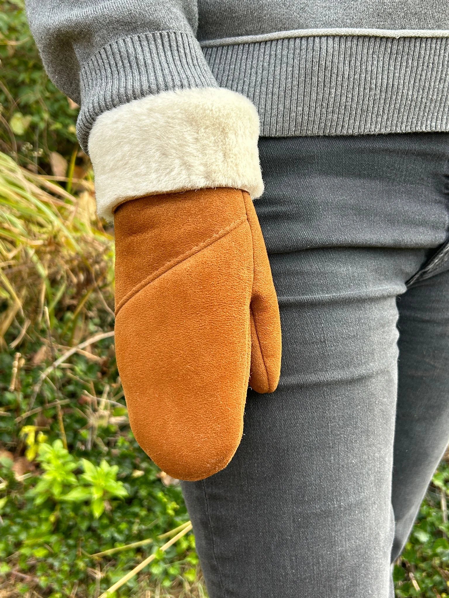 Close-up view of the haven sheepskin mitten in amber