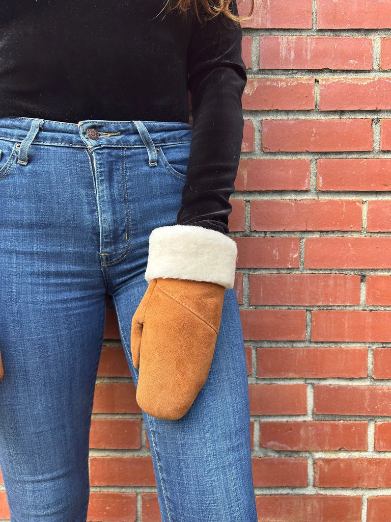 Close-up view of the haven sheepskin mitten in amber