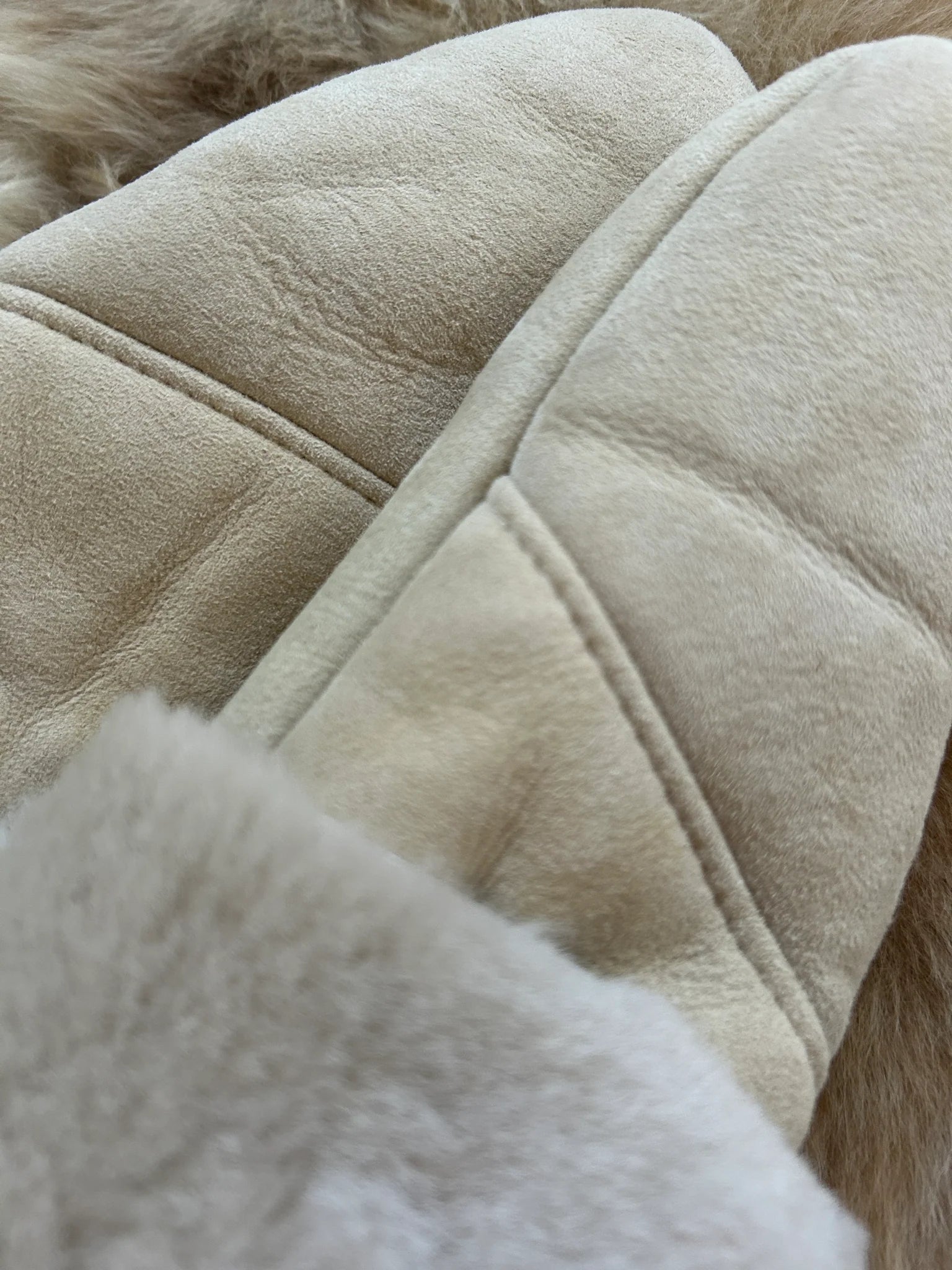 Close-up of the haven sheepskin mitten in cream