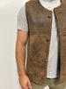 the rancher sheepskin vest worn over a gray shirt