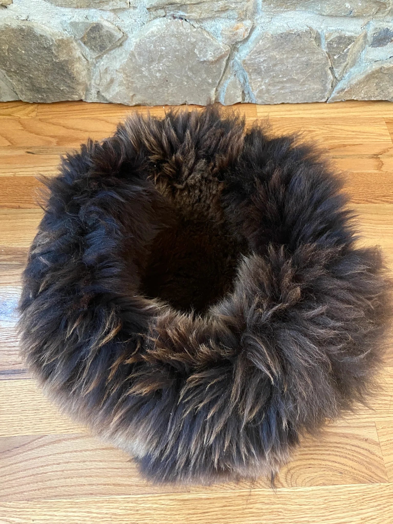 The snug in brown on a wooden floor