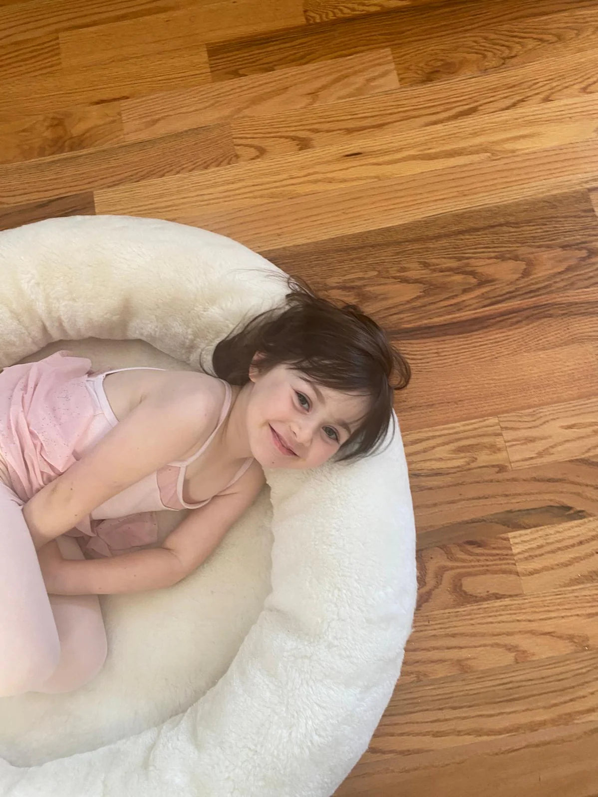 Child lying on the snugly