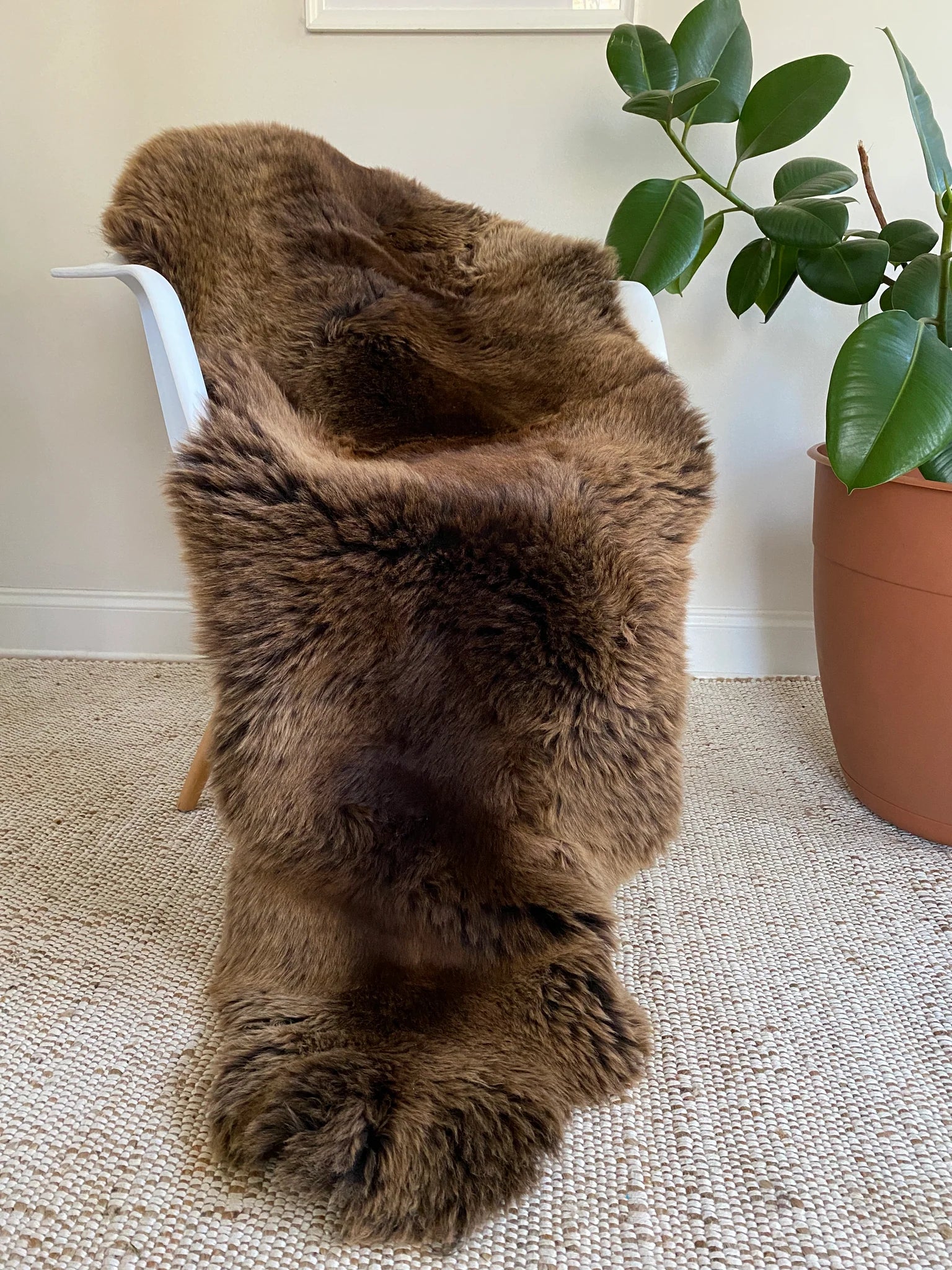 Vibrant brown double sheepskin over a chair 