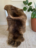 Vibrant brown double sheepskin over a chair 