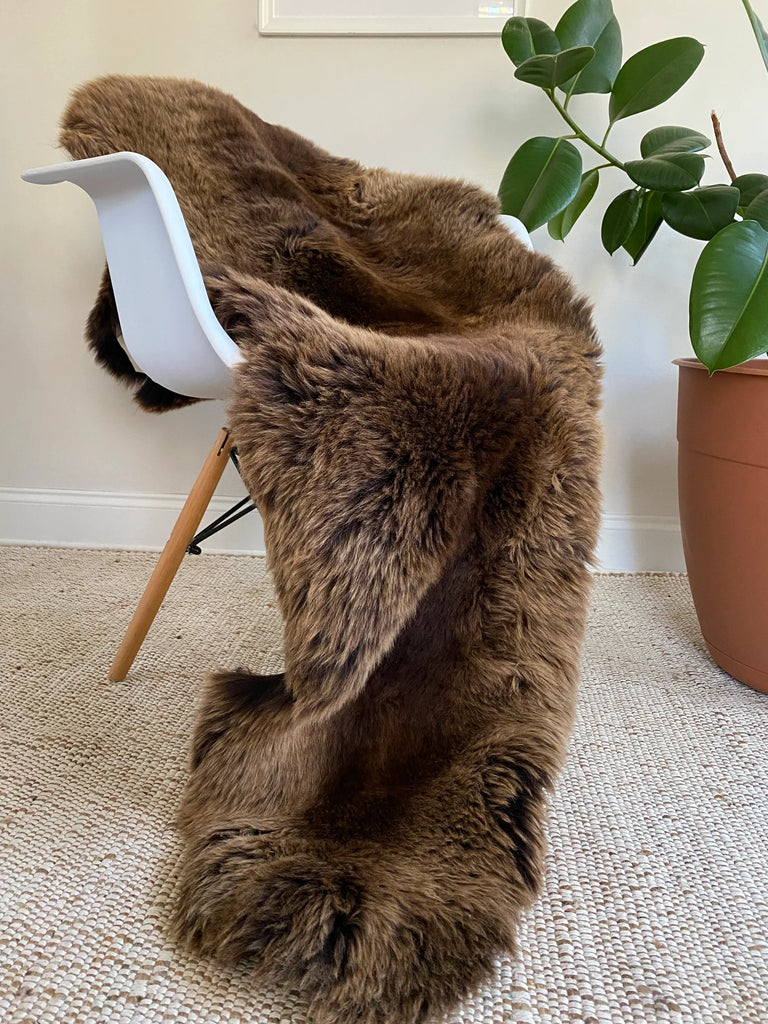 Vibrant brown double sheepskin over a chair 