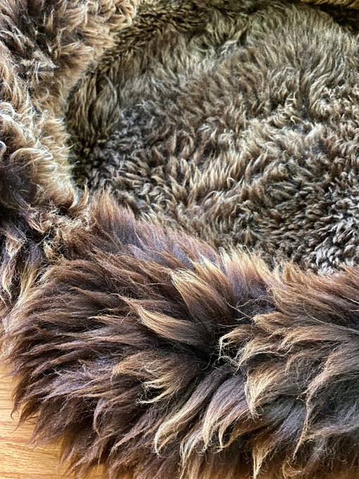 Close-up of fluffy brown pet bed 