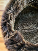 Close-up of fluffy brown pet bed 