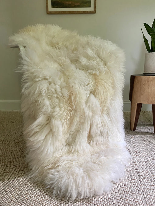 Patchwork ivory sheepskin on a chair
