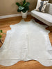 white cowhide rug 
