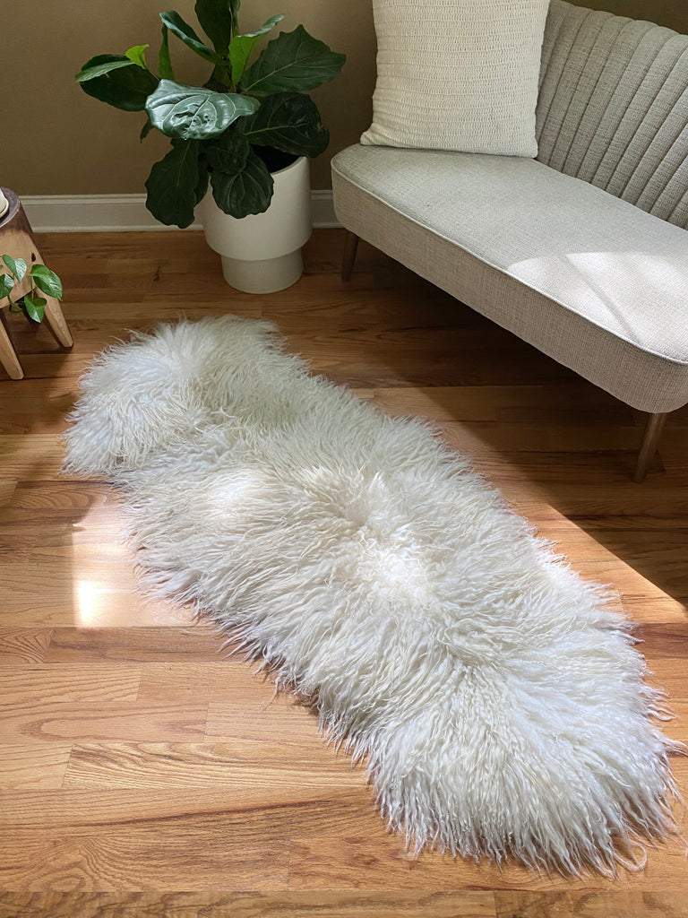 white sheepskin couch cover